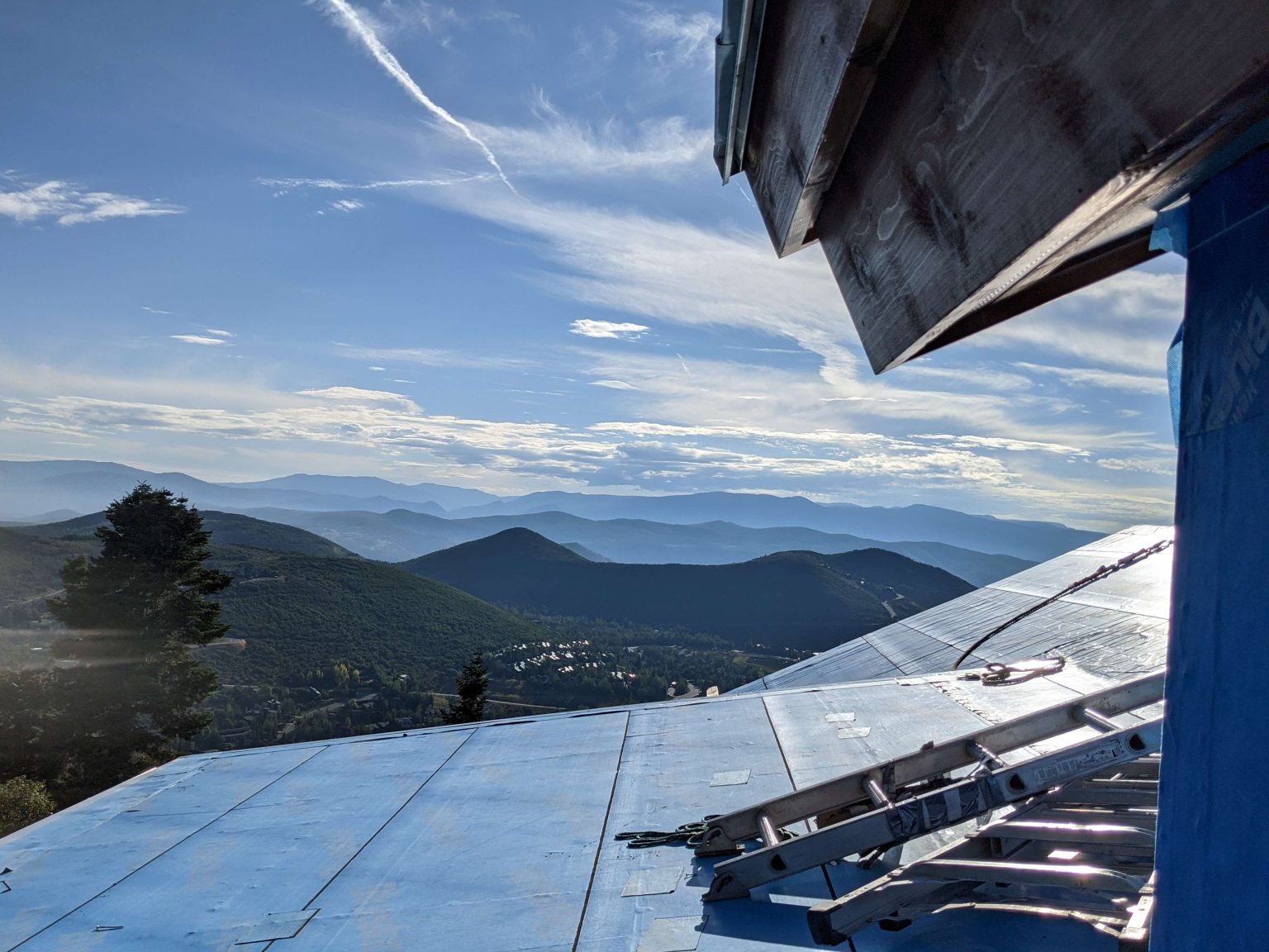 A rooftop view of a home in Park City, Utah undergoing a metal roof installation.